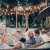 Stylish,Hipster,Couple,Cuddling,And,Relaxing,In,Hammock,Under,Retro